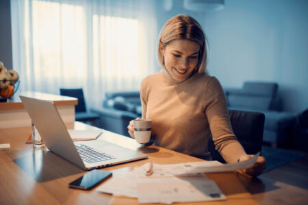 woman completing tax debt consolidation paperwork