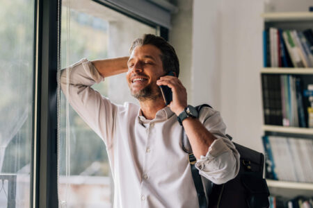 man on phone smiling because he got an irs levy release